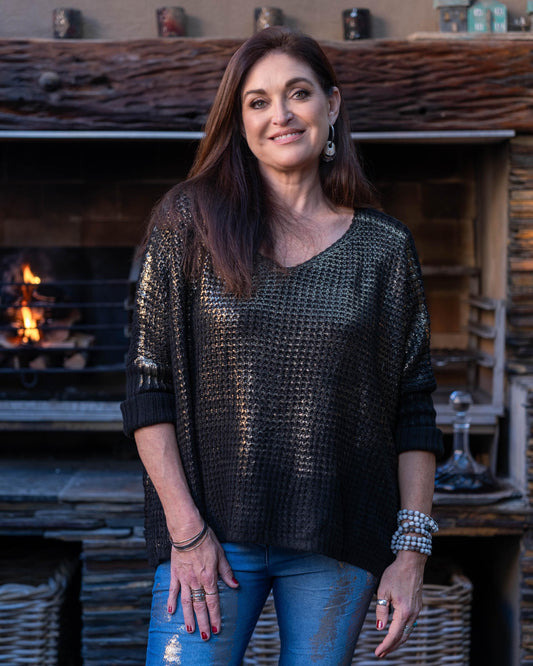Winter is in full swing which asks for warm knits which is both stylish and comfortable. Our block cut silhouette offers a flattering fit for all body types, adding a touch of modern elegance to your outfit. Adorned with a sophisticated golden foil print for that WOW factor and ribbed sleeves that not only provide a snug fit but also add a textural contrast to the smooth knitted fabric