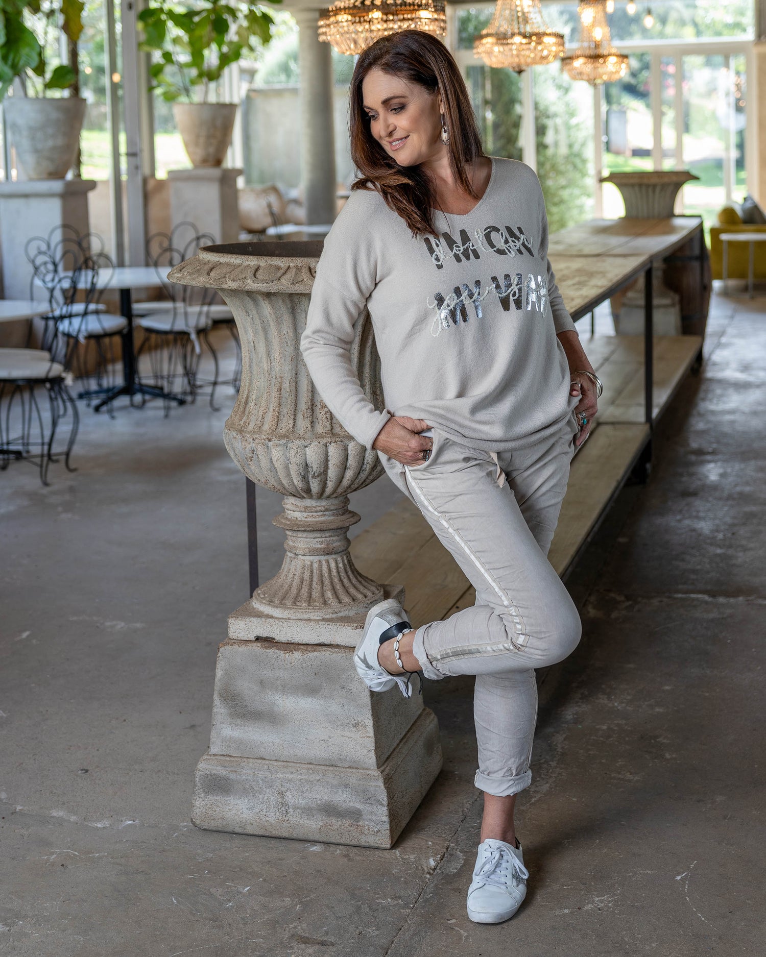 This thick, warm knit features a striking silver foil print with subtle embroidery detail and a braided back insert, making it a standout piece in your winter wardrobe. Designed with a longer length, this knit pairs perfectly with leggings, providing ample coverage and a flattering silhouette. The extended hemline ensures a cozy and chic look, ideal for layering