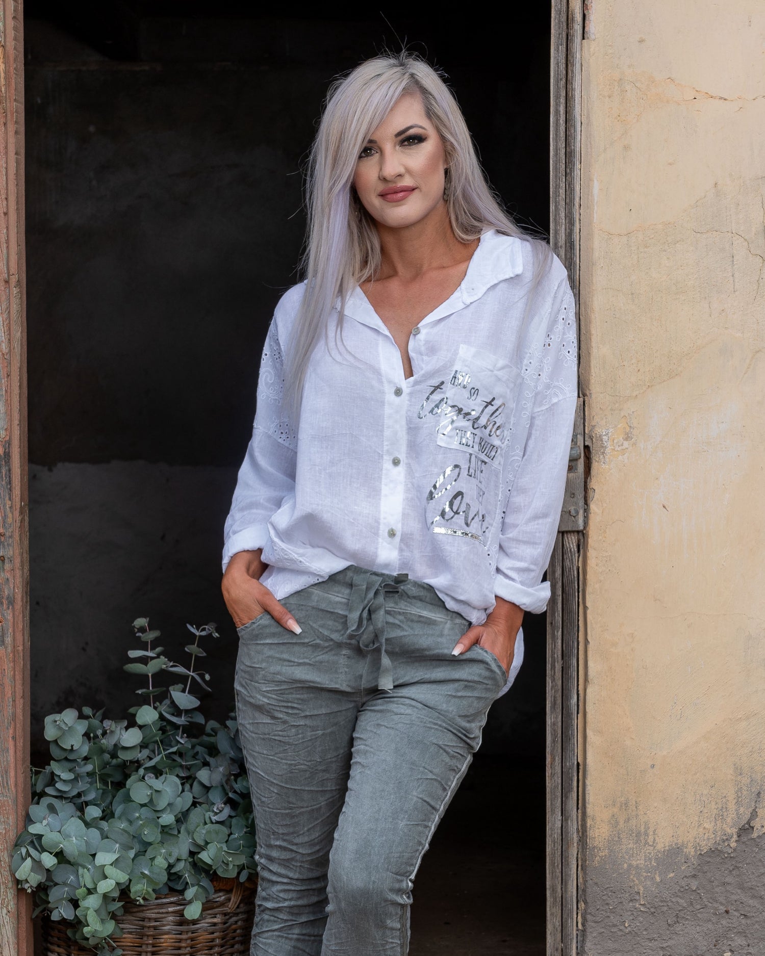 Exquisite anglaise embroidery on the side panels, this top adds a touch of delicate craftsmanship to your look. The silver foil detail enhances the piece with a hint of modern glamour, creating a striking contrast that catches the eye. Made from soft, high-quality fabric, this top offers both comfort and sophistication, making it a versatile addition to your wardrobe. Perfect for dressing up or down, it seamlessly combines classic elements with a chic, updated twist