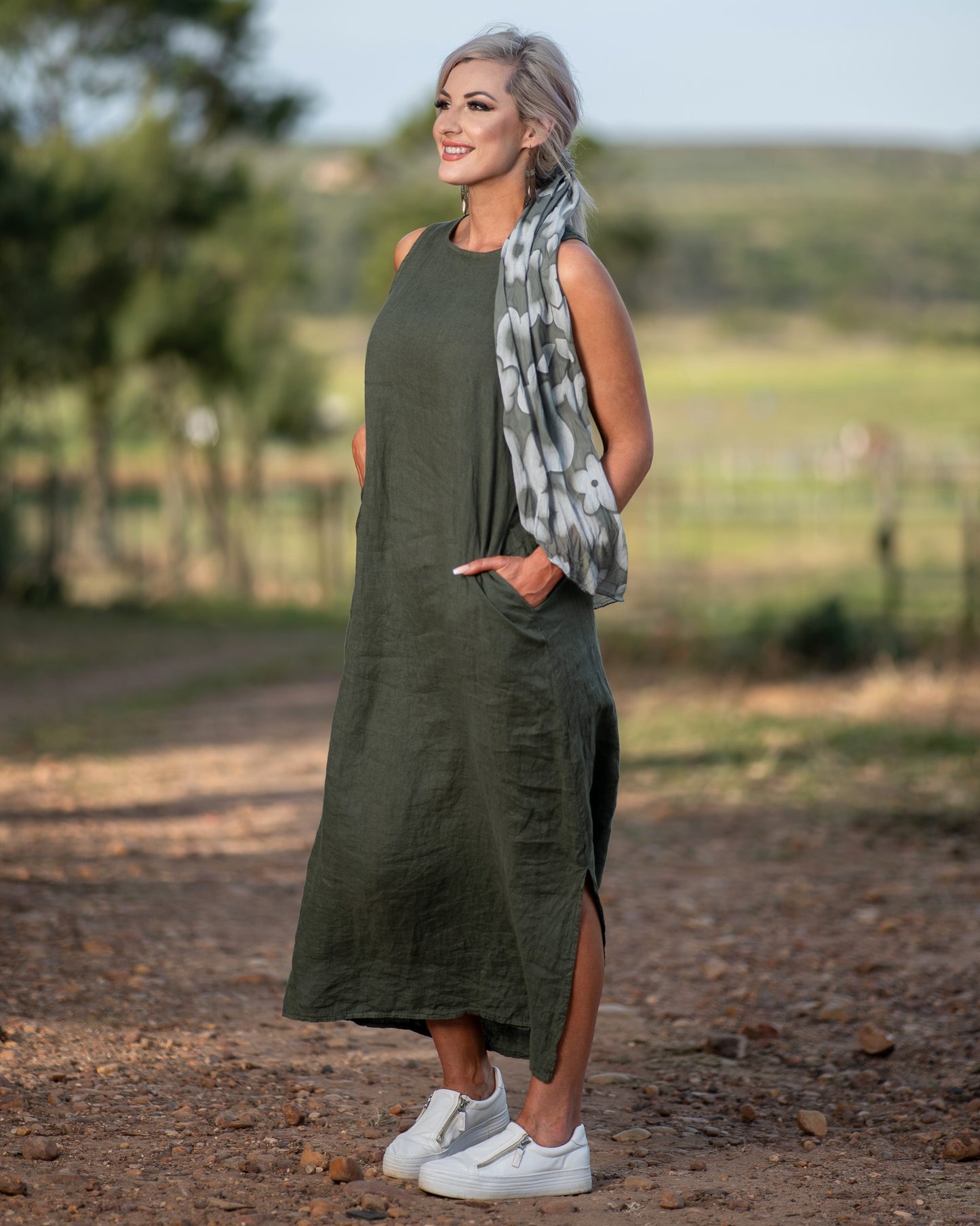 We've received many requests for our linen dresses! To start off strong this sleeveless design offers a flattering neckline that enhances your natural shape, while the breathable linen fabric ensures comfort throughout the day. With two practical side pockets, this dress combines style and functionality, making it perfect for both casual outings and chic occasions. A timeless piece that exudes relaxed sophistication